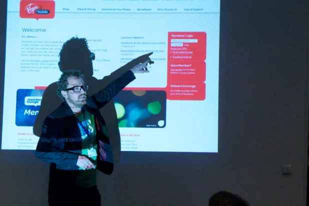 Trent presenting on stage in Berlin in 2013